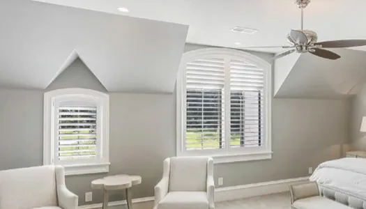 White plantation shutters in a bright Coastal North Carolina room