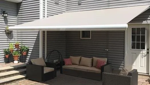 Retractable awning installed above a Coastal North Carolina patio